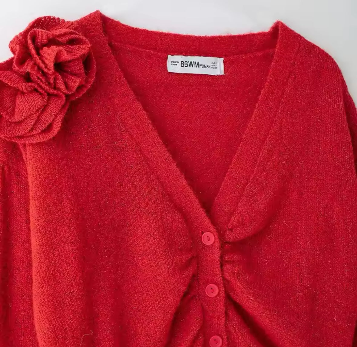 Suéter de punto rojo