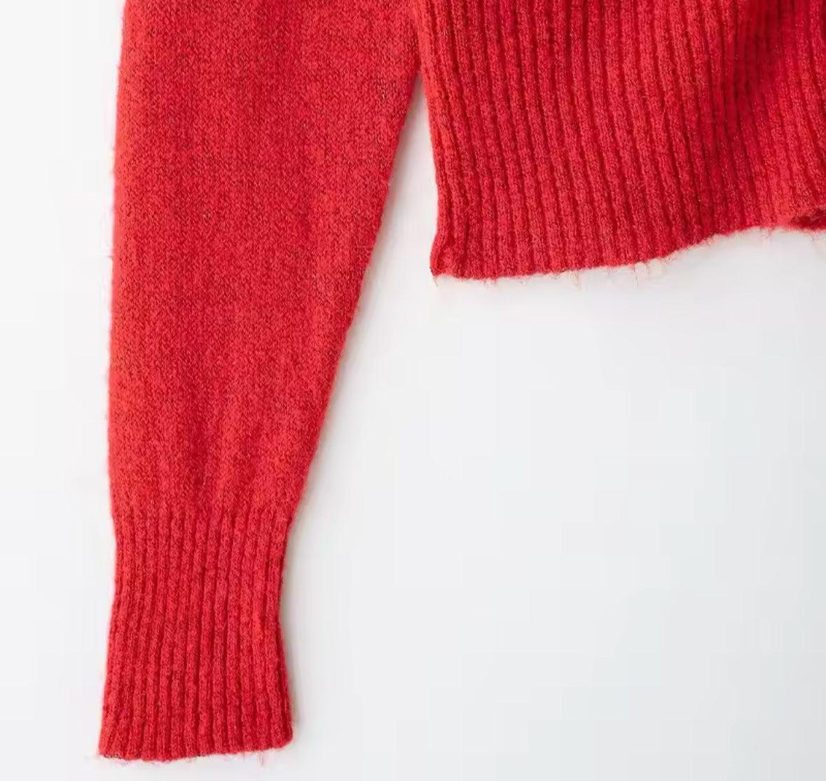 Suéter de punto rojo